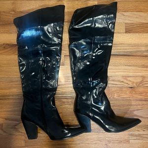 Black knee high heeled boots